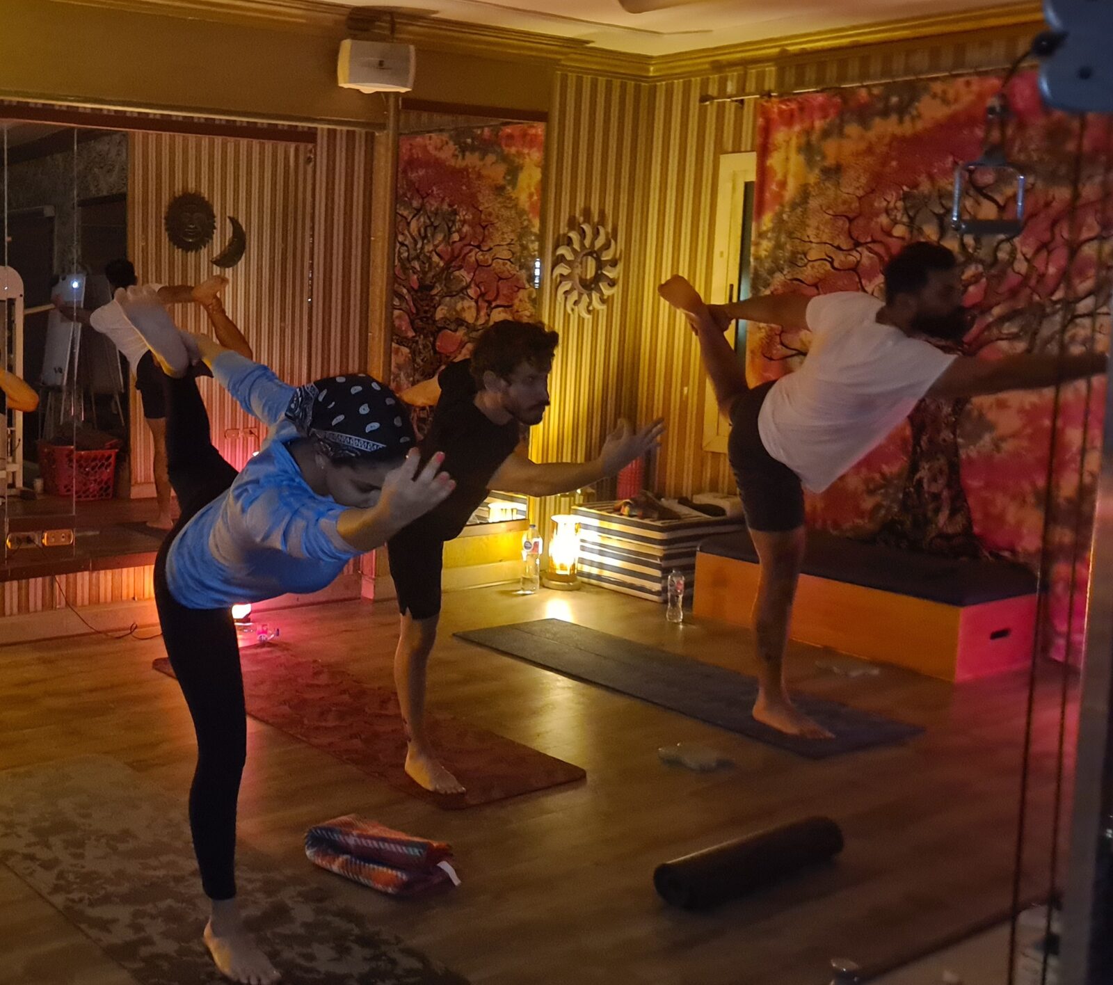 Karim teaching students during a yoga practice session